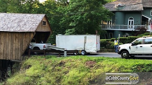 A truck carrying a trailer bonked the metal beam protecting the Concord Road covered bridge in Cobb County.