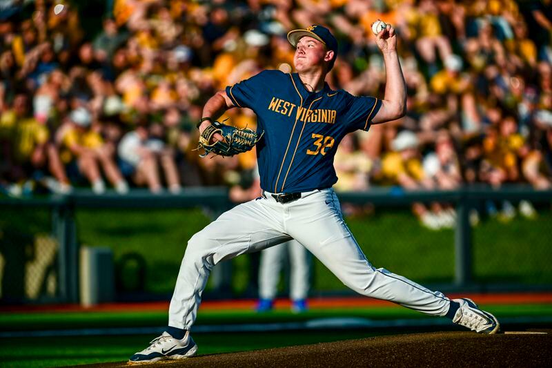 West Virginia pitcher Tyler Switalski throws to a Pittsburgh batter during an NCAA college baseball game in Morgantown, W.Va., Tuesday, April 16, 2024. (William Wotring/The Dominion-Post via AP)