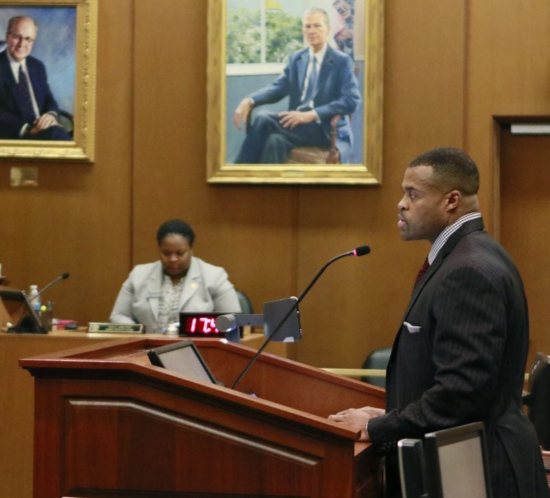 William Whitner (at podium) argues his case involving the state’s tax credit scholarship program, before the Georgia Supreme Court on Monday. BOB ANDRES /BANDRES@AJC.COM