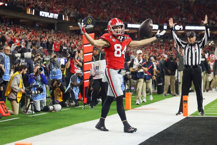 Georgia Bulldogs wide receiver Ladd McConkey (84) catches a touchdown pass against the TCU Horned Frogs  during the second half of the College Football Playoff National Championship at SoFi Stadium in Los Angeles on Monday, January 9, 2023. Georgia won 65-7 and secured a back-to-back championship. (Jason Getz / Jason.Getz@ajc.com)