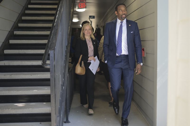 Mayor Andre Dickens takes a tour of The Villages of East Lake alongside Catherine Woodling of The East Lake Foundation on Monday, May 9, 2022. (Natrice Miller / natrice.miller@ajc.com)