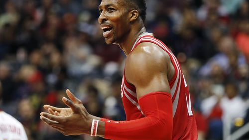 Houston Rockets center Dwight Howard (12) reacts after being called for a foul in the first half of an NBA basketball game against the Atlanta Hawks Saturday, March 19, 2016, in Atlanta. (AP Photo/John Bazemore)