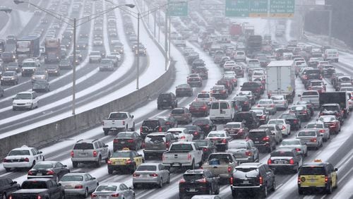 Gridlock gripped the downtown connector and countless other highways, surface roads and side streets on Jan. 28, 2014 – known as SnowJam ‘14 – after school systems dismissed early and many employers let workers off at the same time. BEN GRAY / BGRAY@AJC.COM