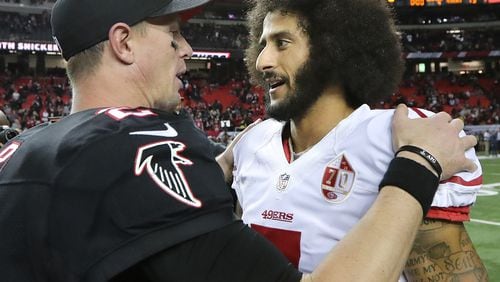 Falcons quarterback Matt Ryan chats with 49ers quarterback Colin Kaepernick after Atlanta’s 41-13 victory over the 49ers on Sunday, Dec. 18, 2016, in Atlanta.     Curtis Compton/ccompton@ajc.com