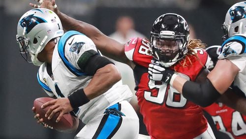 Falcons defensive end Takk McKinley flushes Carolina quarterback Cam Newton out of the pocket. (Curtis Compton/ccompton@ajc.com)