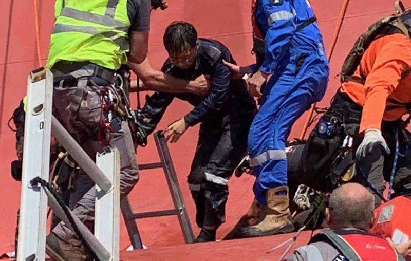 Three of the four crew members trapped aboard a capsized cargo ship were rescued Monday afternoon. The fourth person was rescued later in the day.