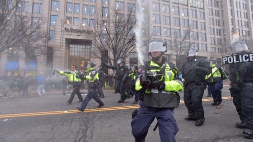 AJC Multimedia photojournalist Hyosub Shin was pepper sprayed while covering Inauguration protests in Washington D.C. Friday, Jan. 20, 2017