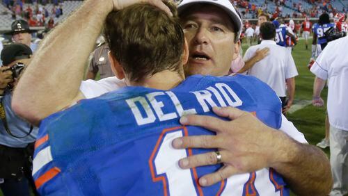 Florida quarterback Luke Del Rio, left, is greeted by Georgia head coach Kirby Smart after an NCAA college football game, Saturday, Oct. 29, 2016, in Jacksonville, Fla. (AP Photo/John Raoux)