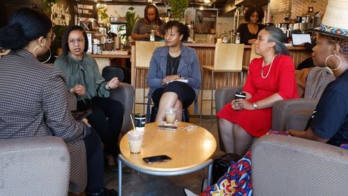 AJC columnists Nedra Rhone (center) holds a roundtable discussion about the Fani Willis hearings with local Black professional women at Black Coffee in Atlanta on Thursday, March 7, 2024. (Natrice Miller/ Natrice.miller@ajc.com)