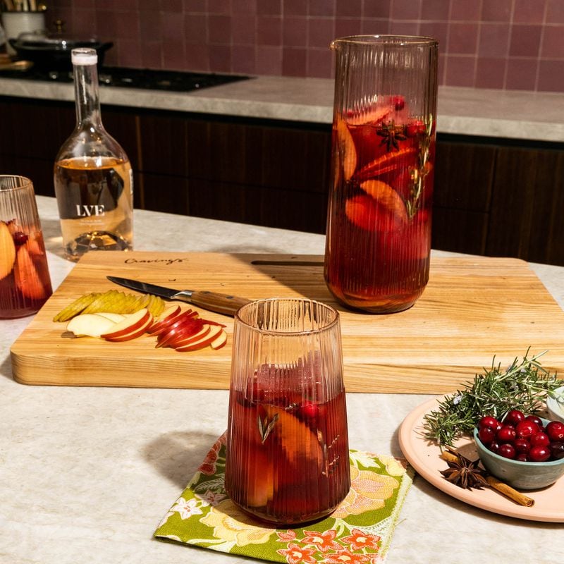 Toast to the Christmas season and beyond with peach-colored tumblers from Cravings by Chrissy Teigen. / Courtesy of Cravings by Chrissy Teigen