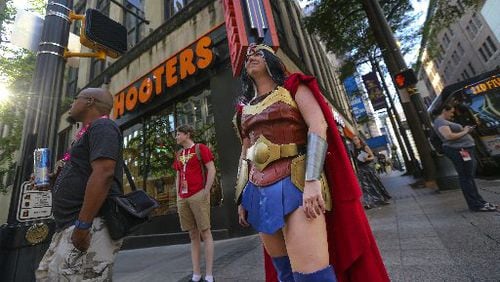 Rebecca Camp of Cartersville attended her fifth Dragon Con over the holiday weekend. Outfitted as Wonder Woman, she walked along Peachtree Street Friday, presumably not having to go far to convene with other superheroes. JOHN SPINK / JSPINK@AJC.COM