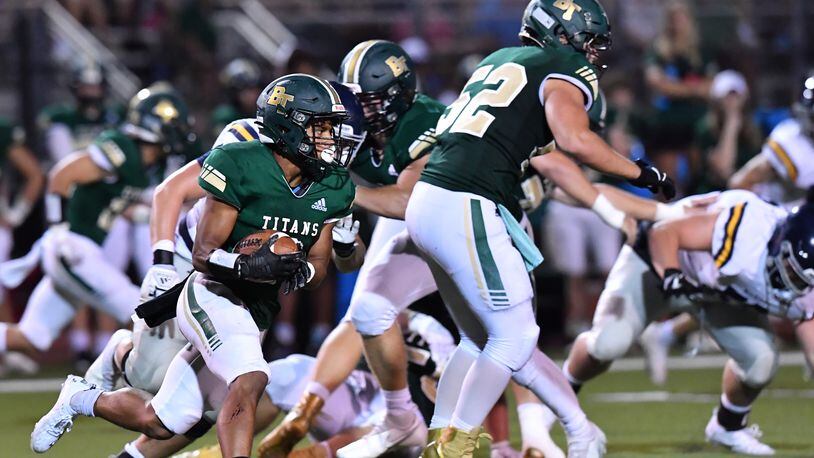 Blessed Trinity's Zach Bolden runs for a first down in 2021. Among current Class 6A schools, Blessed Trinity has the most victories over the past 10 seasons. (Hyosub Shin / Hyosub.Shin@ajc.com)
