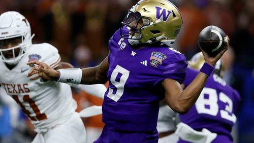 Washington quarterback Michael Penix Jr. throws a pass during the first half of an NCAA college football game Monday, Jan. 1, 2024, in New Orleans. (AP Photo/Butch Dill)