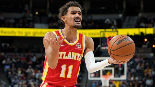 Atlanta Hawks guard Trae Young reacts after being called for a foul against the Denver Nuggets during the second half of an NBA basketball game Friday, Nov. 12, 2021, in Denver. (AP Photo/David Zalubowski)