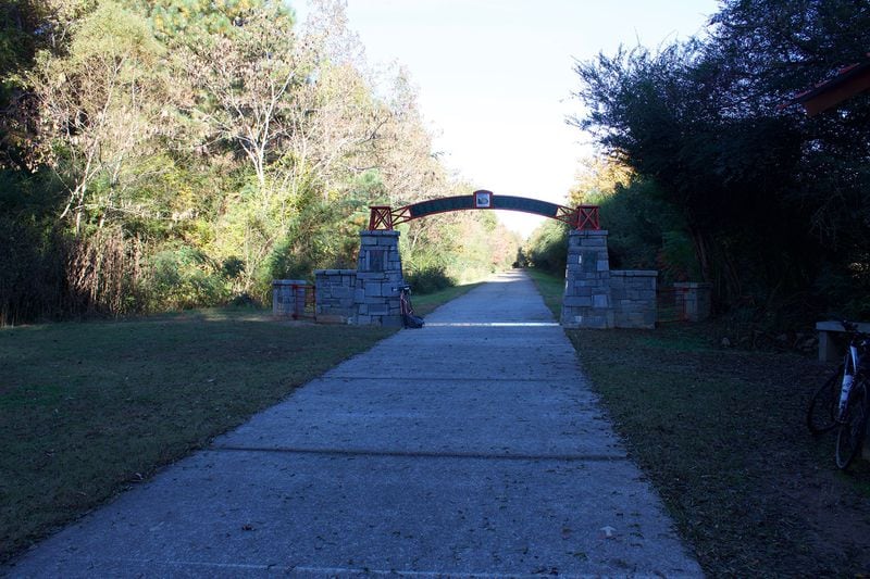 A stone arch marks where Georgia’s Silver Comet Trail connects with Alabama’s Chief Ladiga Trail. PHOTO CREDIT: Daren Wang