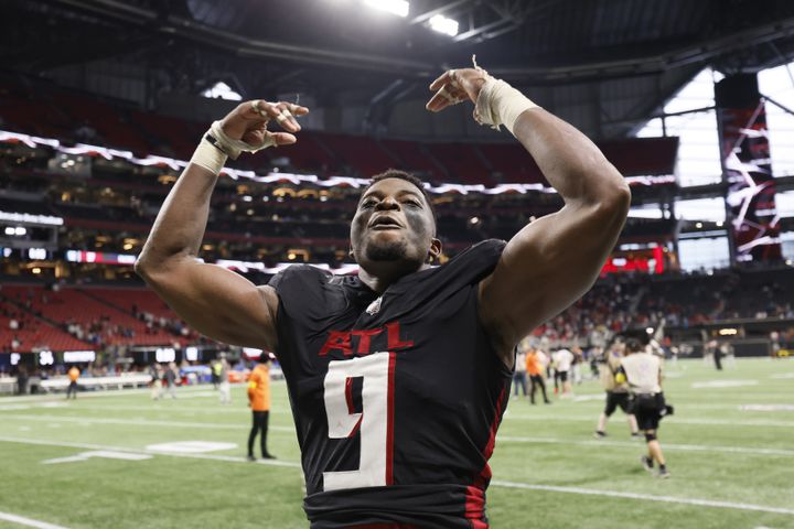 Falcons linebacker Lorenzo Carter reacts after his team defeated the Panthers in overtime Sunday in Atlanta. (Miguel Martinez / miguel.martinezjimenez@ajc.com)