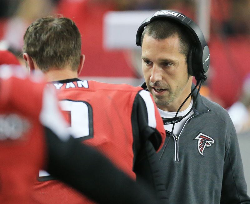 Falcons offensive coordinator Kyle Shanahan confers with quarterback Matt Ryan on the sidelines in 2015.  Curtis Compton / ccompton@ajc.com