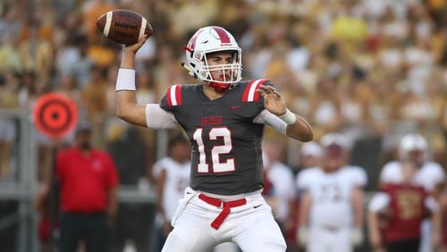 Archer QB Carter Peevy (12) attempts a pass in the first quarter against Mill Creek at Archer High School Friday, September 7, 2018, in Lawrenceville, Ga. (Jason Getz/Special)