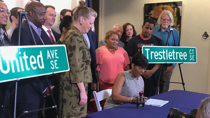 Atlanta Mayor Bottoms signing the street name changes into law on Wednesday