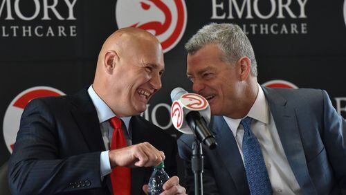 Hawks general manager Travis Schlenk (left) and Hawks principal owner Tony Ressler share a laugh before the news conference to officially introduce Schlenk at Philips Arena on Friday, June 2, 2017. HYOSUB SHIN / HSHIN@AJC.COM