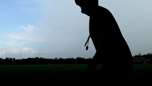 081915 FLOWERY BRANCH: Falcons head coach Dan Quinn heads to a media interview at the conclusion of team practice on Wednesday, August 19, 2015, in Flowery Branch. Curtis Compton / ccompton@ajc.com