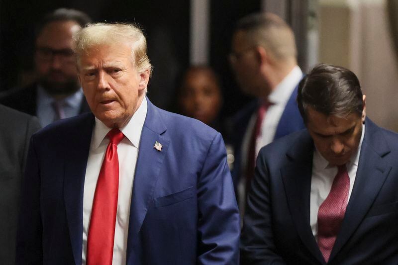 Former President Donald Trump walks with his attorney Todd Blanche in Manhattan criminal court, Monday, May 6, 2024 in New York. (Brendan McDermid/Pool Photo via AP)