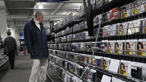 FILE PHOTO: A man shops for music at a Best Buy store.