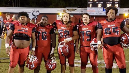 Harlem's offensive line (from right, Jacques Ryles, Antonio Henderson, Joe Odom, lane Logue,  Jordan Grant) as a big reason for A.J. Brown's school-record 2,007 rushing yards this season. The running back went over the 2,000-yard mark with a 194-yard effort last week against Westside of Augusta.
