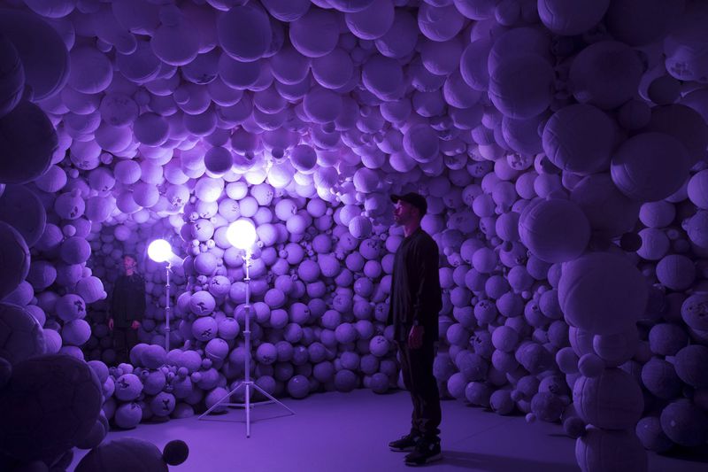 “Daniel Arsham: Hourglass,” a new show at the High Museum, includes this cavern of lavender spheres. The purple balls are replicas of basketballs and volleyballs, cast in a mixture of gypsum and amethyst crystals. Photo: courtesy of High Museum of Art.