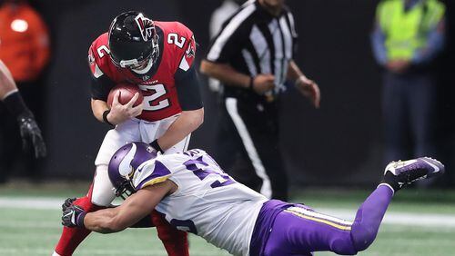 December 3, 2017 Atlanta: Falcons quarterback Matt Ryan is tackled by Vikings linebacker Anthony Barr on a quarterback keeper during the second half in a NFL football game on Sunday, December 3, 2017, in Atlanta.  Curtis Compton/ccompton@ajc.com