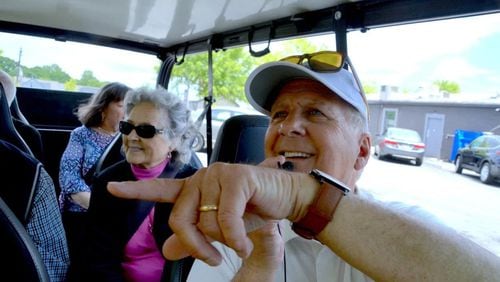 Lilburn Mayor Johnny Crist points out an upcoming development in the city's Old Town area during a tour he led for a small group. He recently began giving tours to show people the city's history as well as what is planned for the future. (Photo Courtesy of Curt Yeomans/Gwinnett Daily Post)