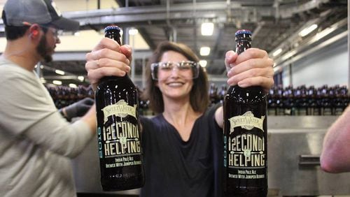 Jen Hidinger bottling Second Helping at Sweetwater. (The Giving Kitchen)