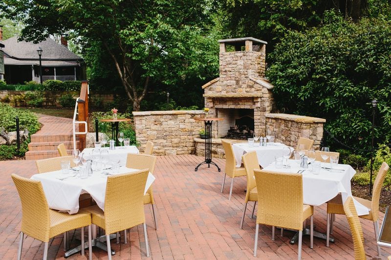 In historic Roswell, Table & Main offers a brick-paved garden patio surrounded by lush greenery, with a stone fireplace to warm up diners in cooler weather. CONTRIBUTED BY ANDREW THOMAS LEE