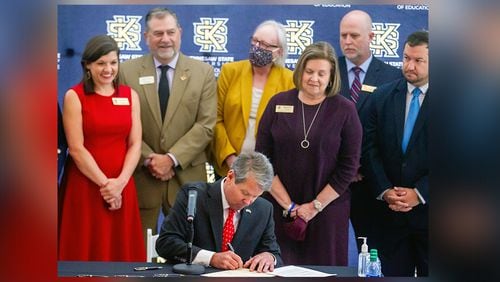 Gov. Brian Kemp signs a half-dozen education bills, including one that seeks to expand the teacher workforce at Kennesaw State University, Tuesday, May 4, 2021. Teachers hope that ample reserves in the state treasury will prompt him to give them a promised pay raise in 2022. (Steve Schaefer for The Atlanta Journal-Constitution)