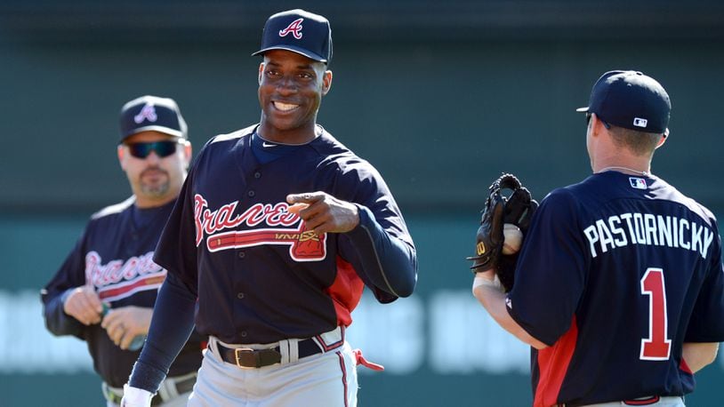 Former Braves Fred McGriff first baseman talks with infielder Tyler Pastornicky during fielding drills during spring training several years ago.
