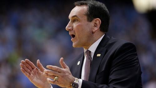 Duke head coach Mike Krzyzewski directs his team during the first half of an NCAA college basketball game against North Carolina in Chapel Hill, N.C., Wednesday, Feb. 17, 2016. (AP Photo/Gerry Broome)