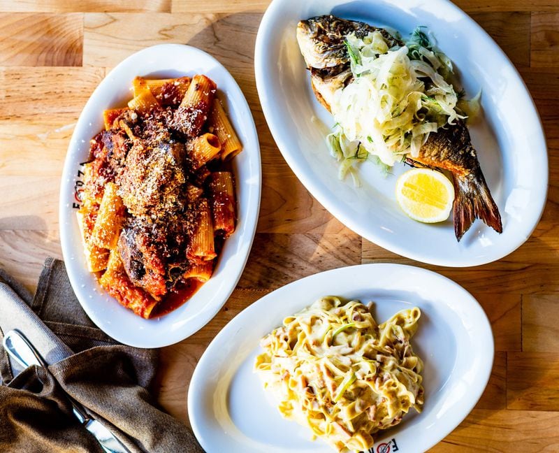 Three dishes at Forza Storico (clockwise from left): Sugo di Coda (rigatoni in tomato sauce with bone-in oxtail), pan-seared whole sea bream and Papalina (creamy fettuccine tossed with fat slivers of prosciutto cotto). CONTRIBUTED BY HENRI HOLLIS