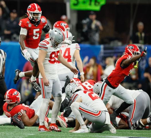 Ohio State Buckeyes place kicker Noah Ruggles (95) reacts after he missed a field goal wide left at the end of the fourth quarter of the College Football Playoff Semifinal between the Georgia Bulldogs and the Ohio State Buckeyes at the Chick-fil-A Peach Bowl In Atlanta on Saturday, Dec. 31, 2022.  Georgia won, 42-41. (Jason Getz / Jason.Getz@ajc.com)