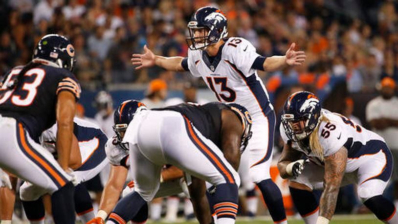 FILE - In this Aug. 11, 2016, file photo, Denver Broncos quarterback Trevor Siemian (13) calls a play at the line of scrimmage during the first half of an NFL preseason football game against the Chicago Bears in Chicago. The Carolina Panthers are out to rattle Siemian Thursday night, Sept. 8, in his first start for the Super Bowl champion Broncos. Thing is, his teammates say they've never seen the strong-armed, mobile QB lose his cool. (AP Photo/Nam Y. Huh, File)