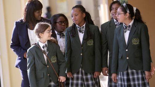 Nina Gilbert, shown here in 2012 with students, founded Ivy Preparatory Academy Charter School in Norcross in 2008. The once-vaunted Gwinnett charter school closed this year, but was supposed to reopen when a new location was secured. It appears now the school will not revive.