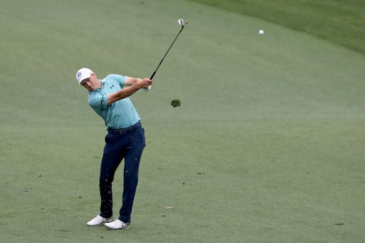 April 9, 2021, Augusta: Jordan Spieth hits his second shot on the seventh fairway during the second round of the Masters at Augusta National Golf Club on Friday, April 9, 2021, in Augusta. Curtis Compton/ccompton@ajc.com