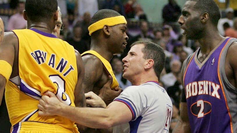NBA official Tim Donaghy separates Phoenix Suns and Los Angeles Lakers players during the second half of the Lakers' 99-92 victory in an NBA basketball first-round playoff game in this April 28, 2006 file photo, in Los Angeles. Jeff Lewis/AP