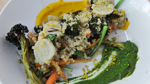 Grain Bowl with quinoa, baby Vidalia onions, turnip greens, roasted broccoli and carrots at Ration and Dram. (CONTRIBUTED BY BECKY STEIN)