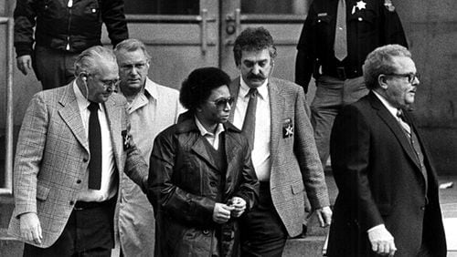 Wayne Williams is escorted from the Fulton County Courthouse on Jan. 26, 1982. Between 1979 and 1981, 30 young African-Americans between ages 9 and 28 were either killed or declared missing. Williams received a life sentence for killing two of the victims.