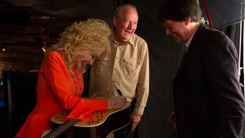 Dolly Parton signs Martin D-28 guitar. Parton is among the 76 of the 101 country music artists interviewed for the series who signed two Martin D-28 guitars.