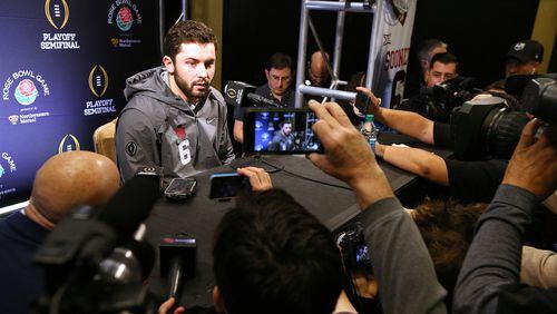 Oklahoma quarterback Baker Mayfield, who has been battling flu-like symptoms, takes questions after showing up late for the last 20 minutes of his team’s Media Day for the Rose Bowl at a Los Angeles hotel.