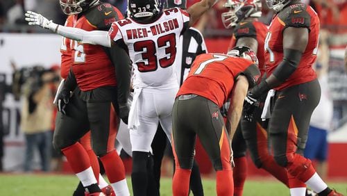 December 18, 2017 Tampa: Buccaneers kicker Patrick Murray drops his head in dejection missing a field goal that would have tied the game as time expires while Falcons cornerback Blidi Wreh-Wilson starts the celebration holding on for a 24-21 victory over the Bucs in a NFL football game on Monday, December 18, 2017, in Tampa.  Curtis Compton/ccompton@ajc.com
