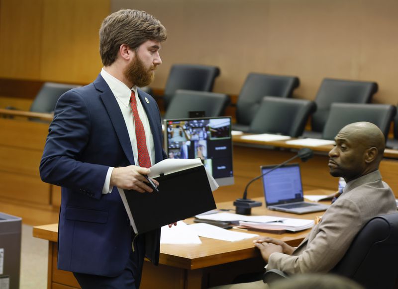 Fulton prosecutor Donald Wakeford (left),  returns to his desk after presenting arguments to join special prosecutor Nathan Wade during a  hearing on Georgia Governor Brian Kemp's motion to quash his subpoena from the special purpose grand jury in Atlanta, GA, on Thursday, August 25, 2022.  on Thursday, August 25, 2022.   (Bob Andres for the Atlanta Journal Constitution)