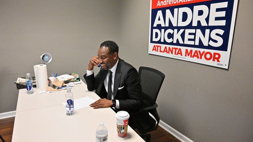 Mayor-elect Andre Dickens makes a phone call the morning after he was elected Atlanta's 61st mayor. (Hyosub Shin / Hyosub.Shin@ajc.com)