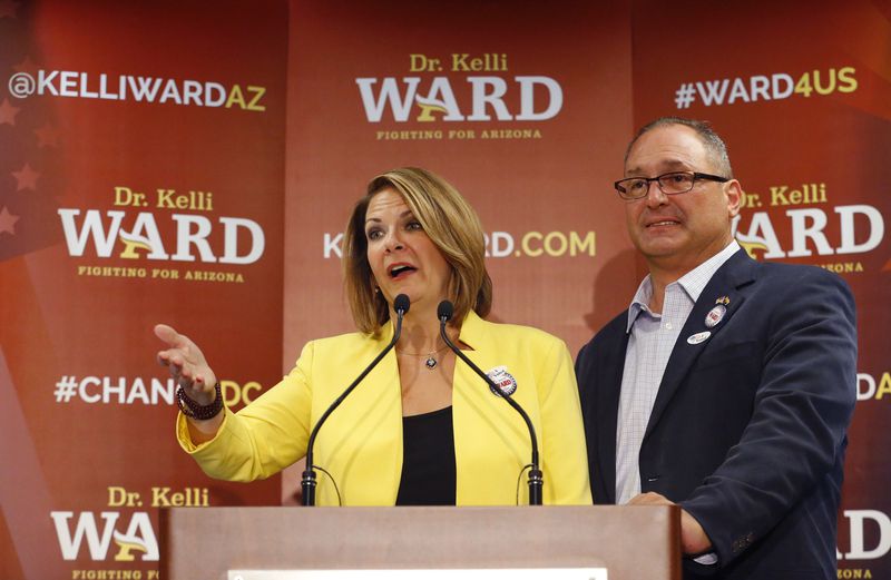 FILE - Kelli Ward, with her husband Michael Ward at her side, concedes to Sen. John McCain, R-Ariz., in the race for the Republican nomination to U.S. Senate, Aug. 30, 2016, at her primary night party at a hotel in Scottsdale, Ariz. Ward and her husband are two of 11 Republicans in Arizona who submitted a document to Congress falsely declaring Donald Trump had beaten Joe Biden in the state during the 2020 presidential election were charged Wednesday, April 24, 2024, with conspiracy, fraud and forgery, marking the fourth state to bring charges against "fake electors." (David Kadlubowski/The Arizona Republic via AP, File)